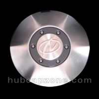 Silver 2001-2002 Oldsmobile Aurora center cap.