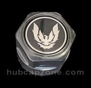 Black Pontiac center cap, chrome/silver firebird.